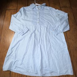 A light blue Zara cutwork embroidery shirt mini dress featuring a shirt collar, long sleeves, and a button-up front placket Extra small on tag  Very g