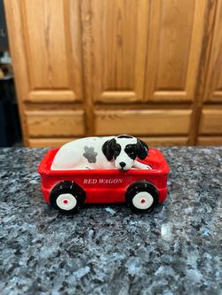 Vintage 1980’s Magnetic Red Wagon and Dog salt & pepper shakers. Size approximately 4 inches long and 2 inches tall. Brand new never used. The dog