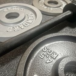 6 ft NEW Olympic Black Barbell with Cast Iron Weight Plates from 5# to 45#. Brute Weight: 278 #