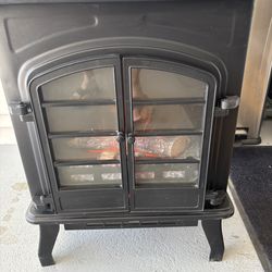 Electric fireplace heater works really well and very cute
