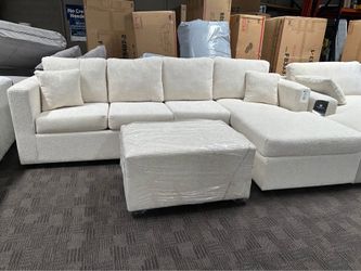 Gorgeous cream sectional and ottoman