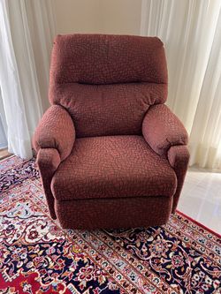 burgundy upholstered recliner chair. 