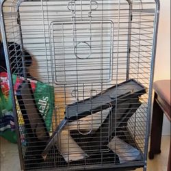 Large animal cage with ramps.