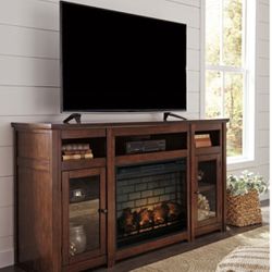 rooms to go Electric fire place/TV stand  it will fit 65 inch tv ,dimensions are 59 x 15.5 x 34 . In person super beautiful then pictures dark cherry 