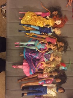 9 Barbie and 1 ken doll for sale