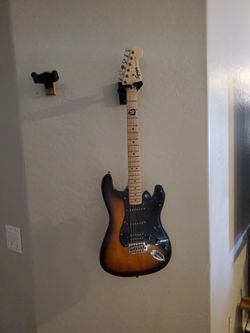 Squier Sonic Stratocaster HSS Electric Guitar and some guitar picks