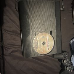 PS3 WITH GAMES AND 2 CONTROLLERS 