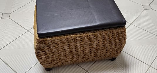 Wicker chest with padded top.