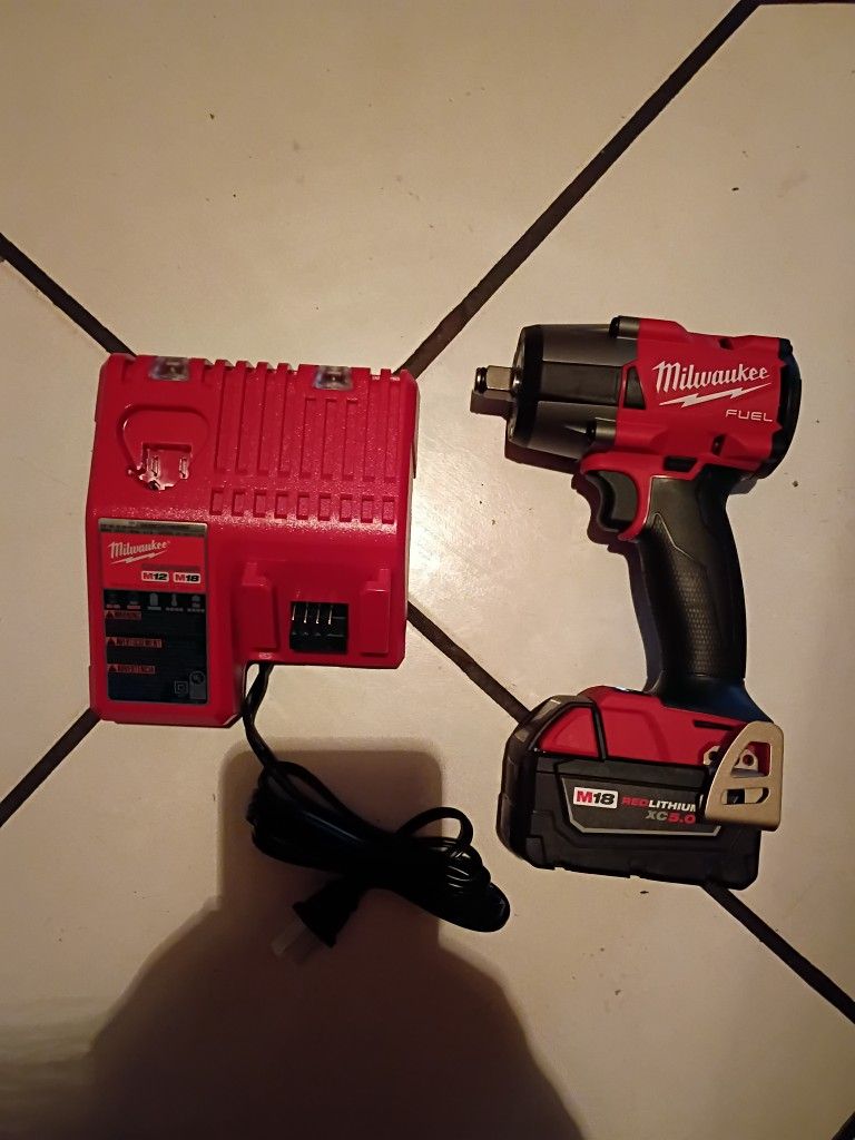 Milwaukee 1/2 Inch Torque Impact . Batery & Charge . Brand New.