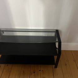 Long entertainment glass top steel and wood table