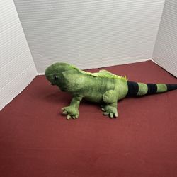 green, plush iguana toy with the word "ARUBA" embroidered 