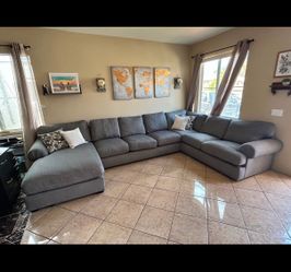 The MOST COMFORTABLE Couch ever. Grey sectional from Jerome’s