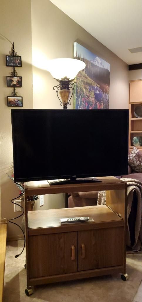 RCA 40 inch television with Remote and tv cart. Two HDMI ports and one USB port.