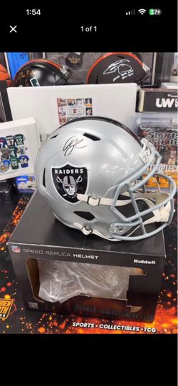 Raiders Full Size Signed Helmet by Geno Smith
