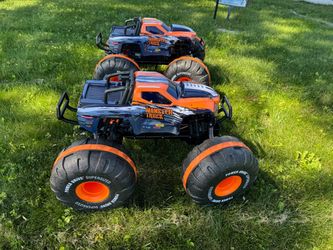 Two Power Dr. monster trucks, remote controlled
