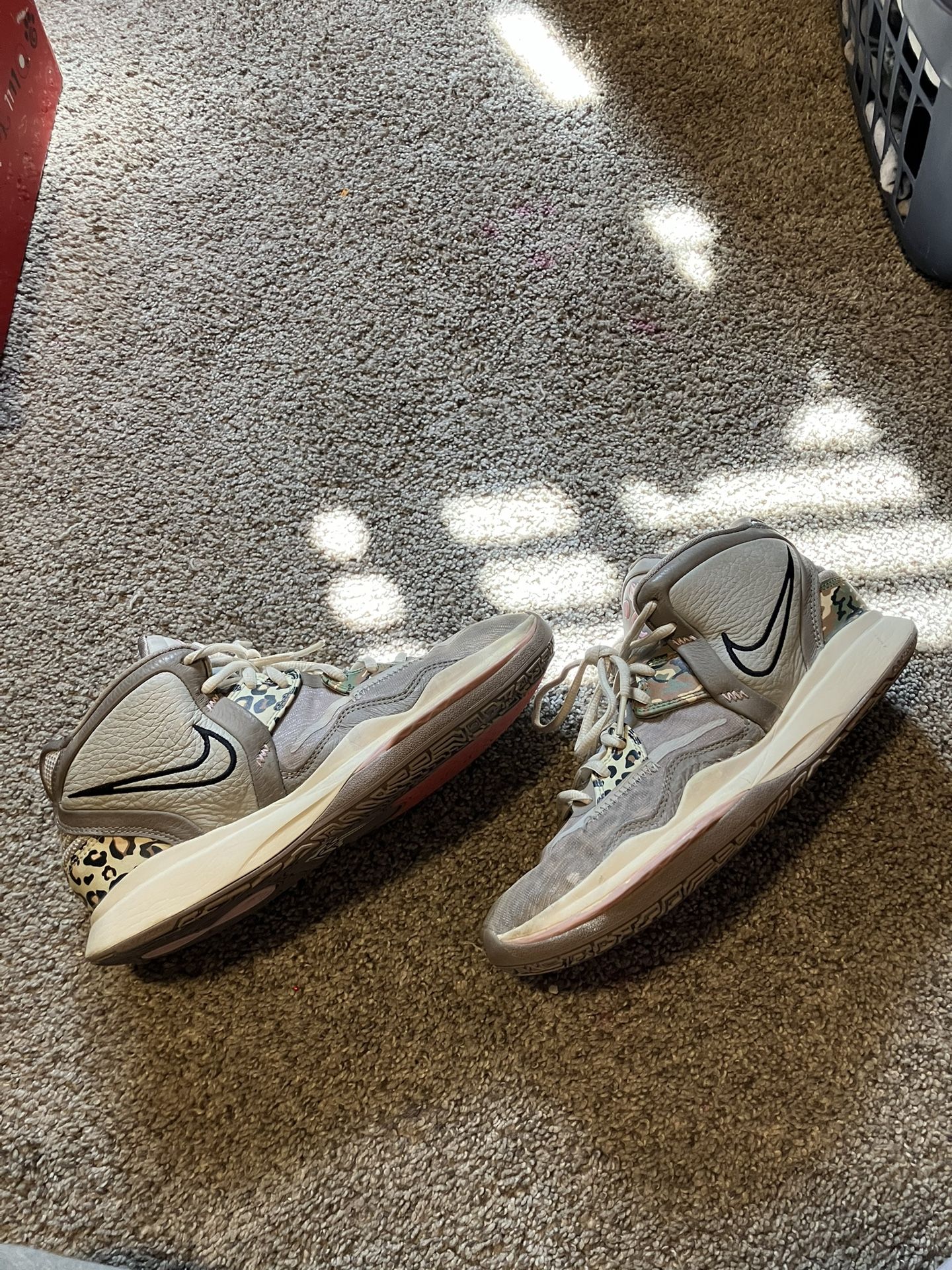 the brand is Kyrie Irving leopard shoes, Size 8.5 in men