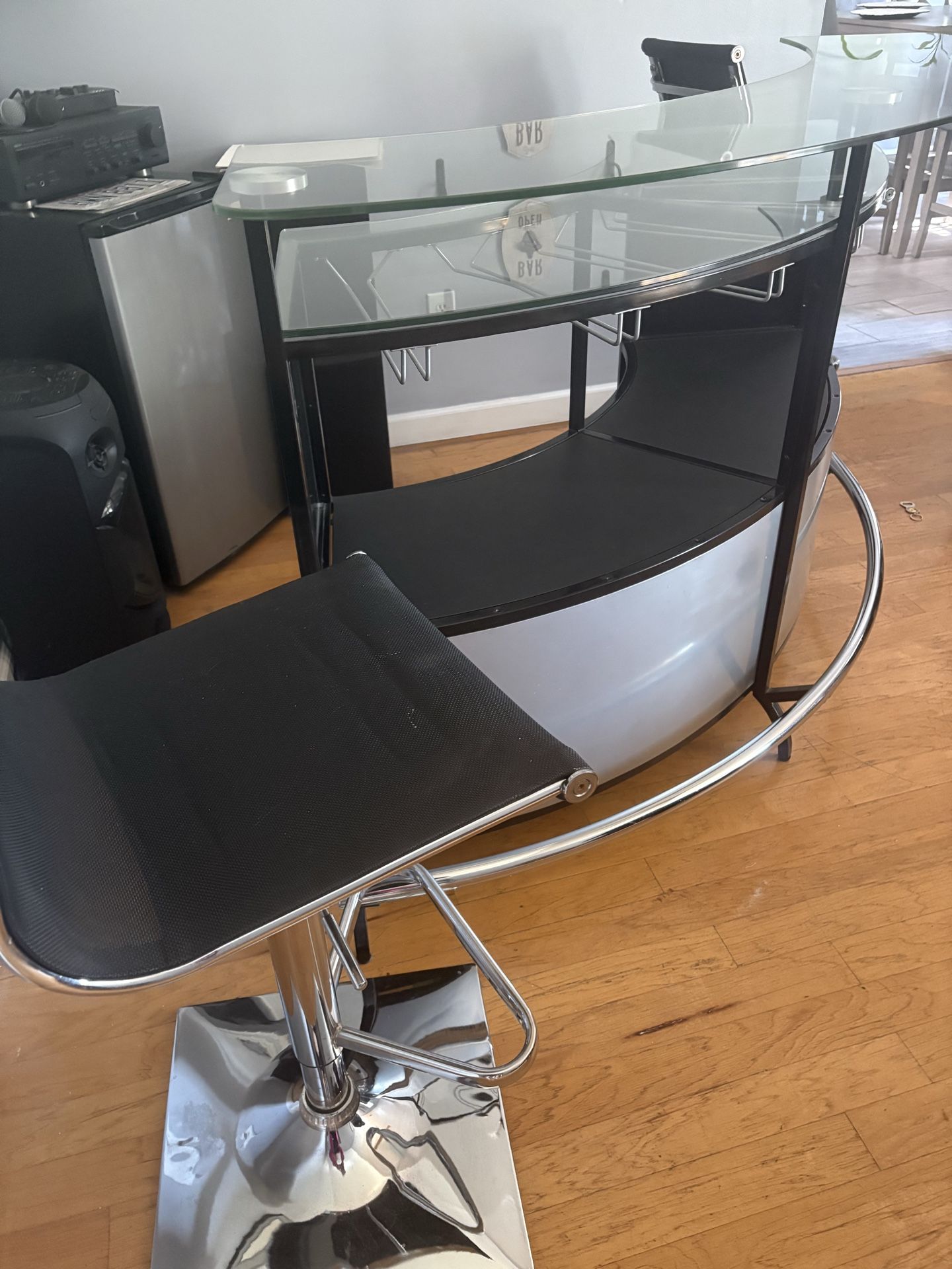 Selling a bar with four stools.