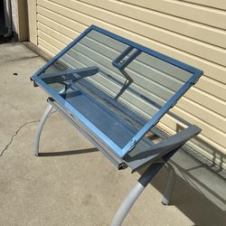38”x23” glass drafting table drawing adjustable tilt with drawer good condition $40 cash. In Ontario 91762