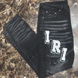 Amiri Black Skinny Jeans with Patched Logo and Distressed Moto Denim