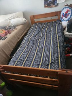 Wooden twin bed.