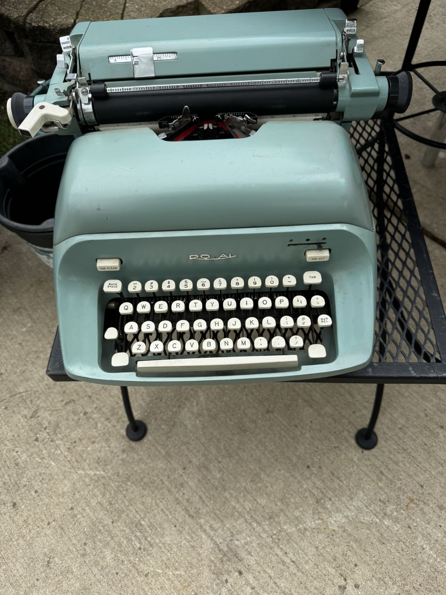 Vintage teal color Typewriter by Royal with cover