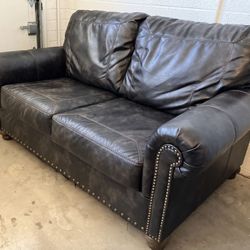 Ashley Furniture Nicorvo Brown Nailhead Trim Leather Loveseat Couch