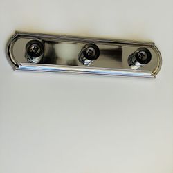 Trans Globe Lighting Vanity Light. 3 bulb assembly. Finish: Polished Chrome. Brand new. Never used. Still in original packaging. Recommended Room Kids