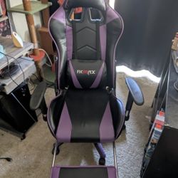 Reclining gaming chair with leg rest