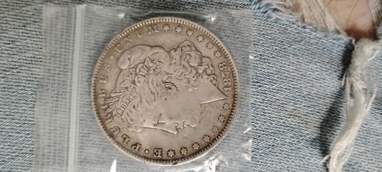 1878 Morgan dollar 7 feathers