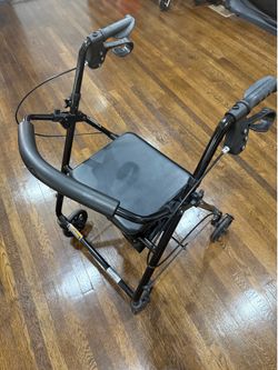 Rollator Walker with seat and storage.