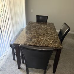 Dining table with 3 chairs and a bench