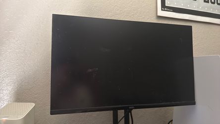 PlayStation 5 with monitor and black controller
