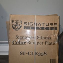35 pound Signtature Fitness(2 Ct.) Rubber plate Weights