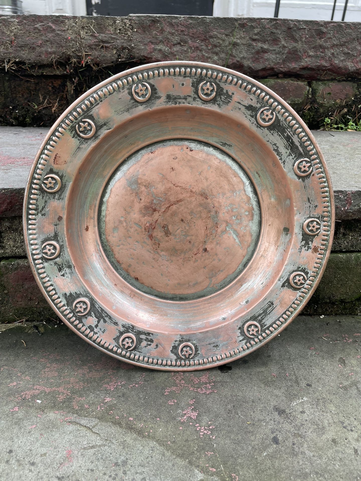 vintage copper embossed bowl/plate. 10 1/2 inches. Makers mark on the back.