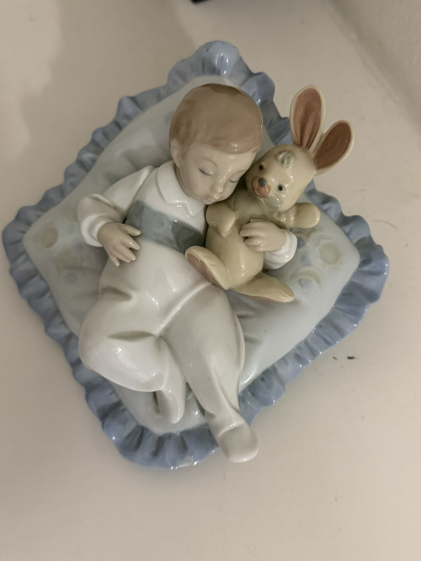 Lladro "Taking a Snooze" #6791, boy holding bunny sleeping on pillow, retired