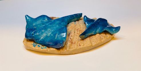 Lovely handmade and hand painted ceramic stingrays on the sand