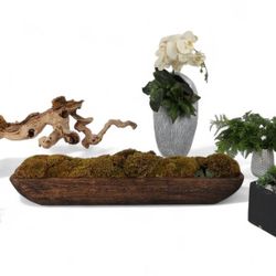 A group of six faux plants in various pots and vases