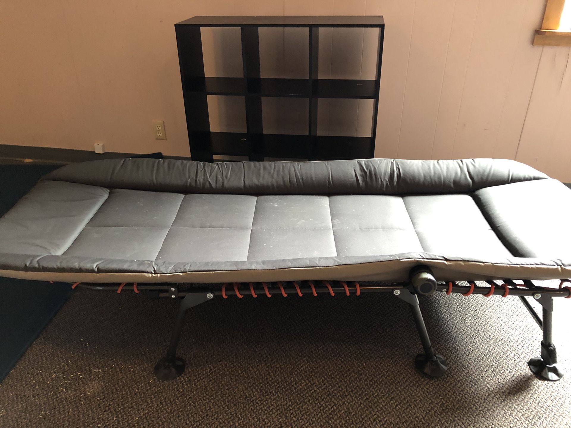 REI folding cot. Adjustable legs super comfortable and packs away neatly.