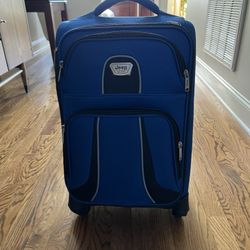 jeep carry on luggage blue spinner expandable - excellent condition-   This was my parents luggage  they bought it for one trip. Non smoking no pet ho