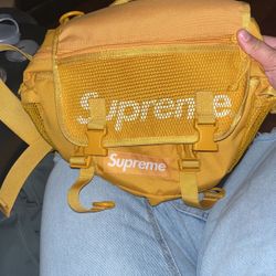 wearing supreme waist bag