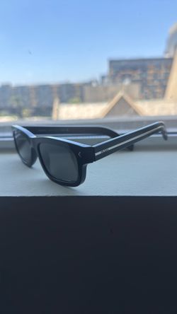 Prada Sunglasses with the iconic metal plaque