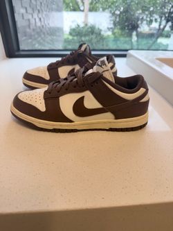Size 6 kids  Nike Dunk Low in the "Cacao Wow" colorway. This design features a sail-colored leather base with dark brown "Cacao Wow" overlays, laces,