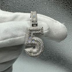 A Moissanite Number charm in Silver with moissanite of 2.29CTW