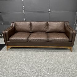 Article genuine leather couch  86" X 34" X 32"). Cleaned and Leather Conditioned.