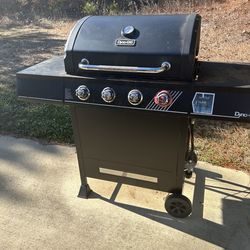BBQ grill (used ) and working comes with a tank and gas