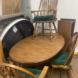 NICE TABLE AND 3 OAK CHAIRS WITH LEAF