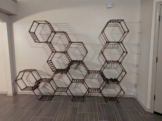 Honeycomb wall floor shelving unit