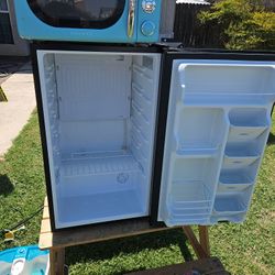 Small Black Fridge Asking 55 Obo And Small Microwave Asking 30 Obo Both Work Fine 