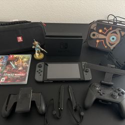 Nintendo Switch V1, HAC-001 with Dock, Case, Holders, And Two Switch Games Lot