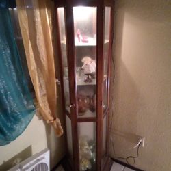 Corner Curio Cabinet With Light Glass Shelves And Mirrored Back